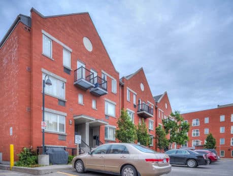 Brick apartment building in Toronto’s East End, showcasing Rivertowne condos and townhomes available through Toronto
