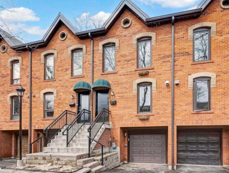 Attractive brick townhouses at 1000 Dundas St E, showcasing a desirable East End property