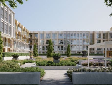 Modern condo building exterior with courtyard garden, showcasing East End living and desirable Toronto real