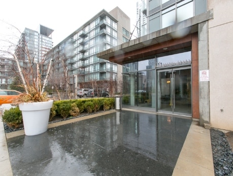 Exterior view of a modern condo building entrance in Toronto’s CityPlace, showcasing the building’s architecture