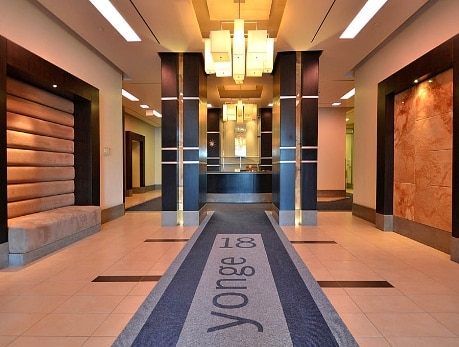 Elegant lobby entrance at 18 Yonge Street, a Financial District condo building in Toronto, showcasing