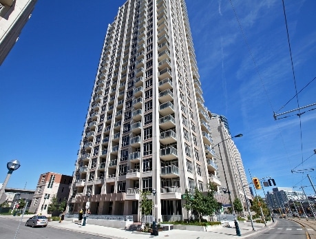 Modern high-rise condo building in Fort York, Toronto, showcasing waterfront views and urban living, as