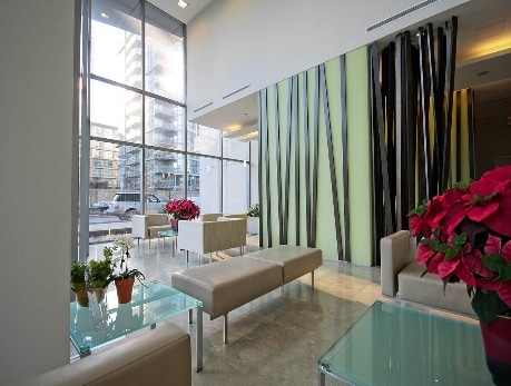 Modern condo lobby at 3 Navy Wharf in Toronto's CityPlace, featuring a bright, open space