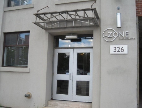 Exterior view of the I-Zone Lofts building at 326 Carlaw Avenue, showcasing its entrance