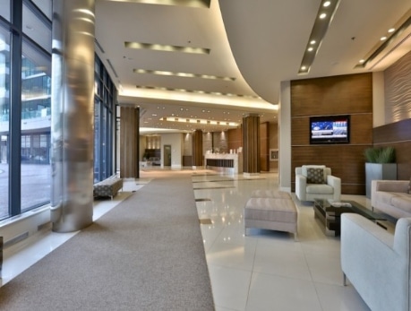 Elegant lobby at 33 Bay St, a Financial District condo building in Toronto, featuring modern