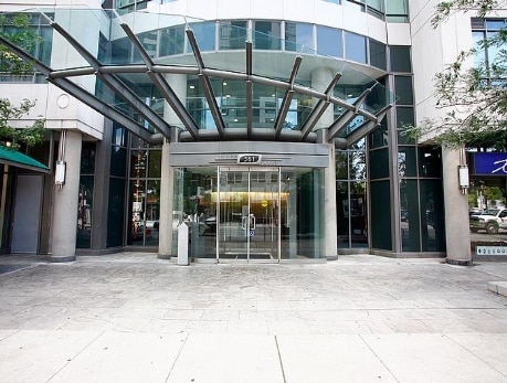 Modern condo building entrance at 361 Front Street West in Toronto's CityPlace, showcasing a glass-enclosed