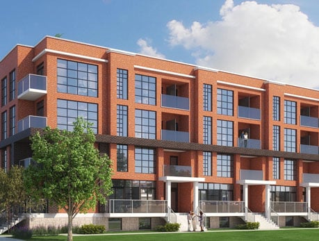 Modern brick condo building exterior showcasing Logan Residences in Toronto’s East End, featuring balconies