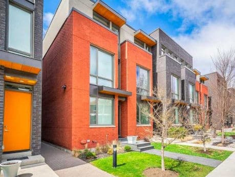 Modern townhomes on Boulton Avenue in Toronto's East End, showcasing vibrant red brick facades