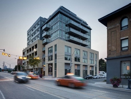 Modern condo building on Queen Street East in Toronto, showcasing East End condos for sale