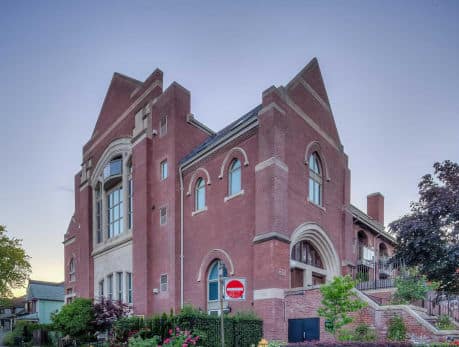 Exterior view of Glebe Lofts condos at 660 Pape Avenue in Toronto’s East End, showcasing