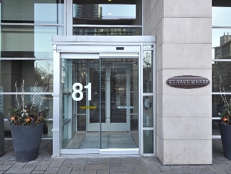 Modern entrance to 81 Navy Wharf condominium building in Toronto's CityPlace, showcasing the building's address